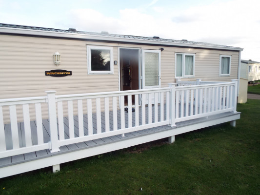 Front door and large decking. Front door and large decking.